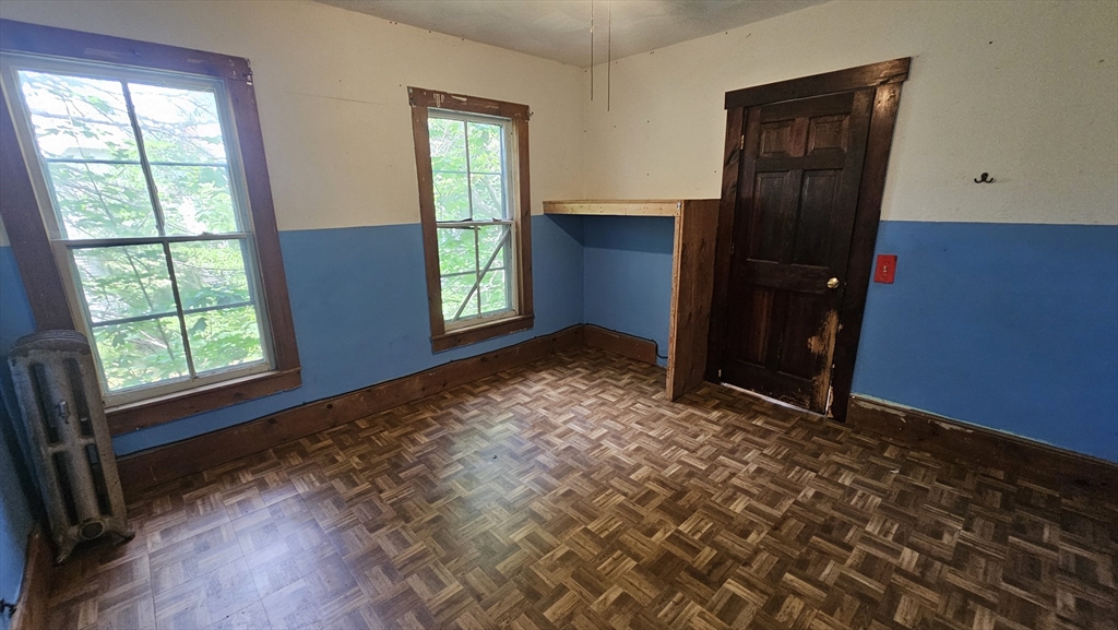 179 Oak Street Springfield, MA 01151 - Photo 19 of 28 an empty room with windows and closet