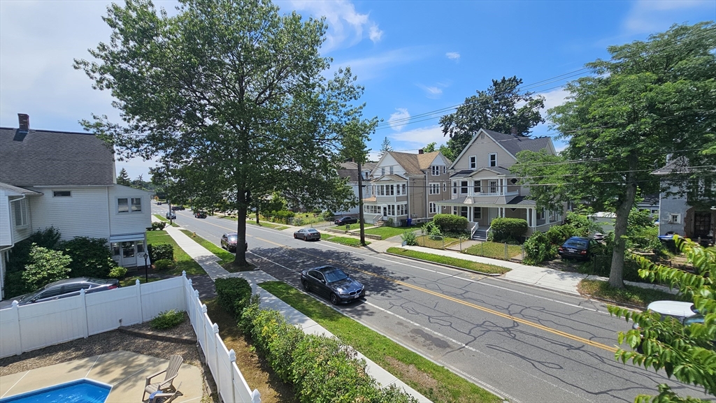179 Oak Street Springfield, MA 01151 - Photo 27 of 28 a house view with a swimming pool and garden