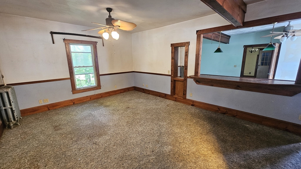 179 Oak Street Springfield, MA 01151 - Photo 6 of 28 wooden floor in an empty room with a window