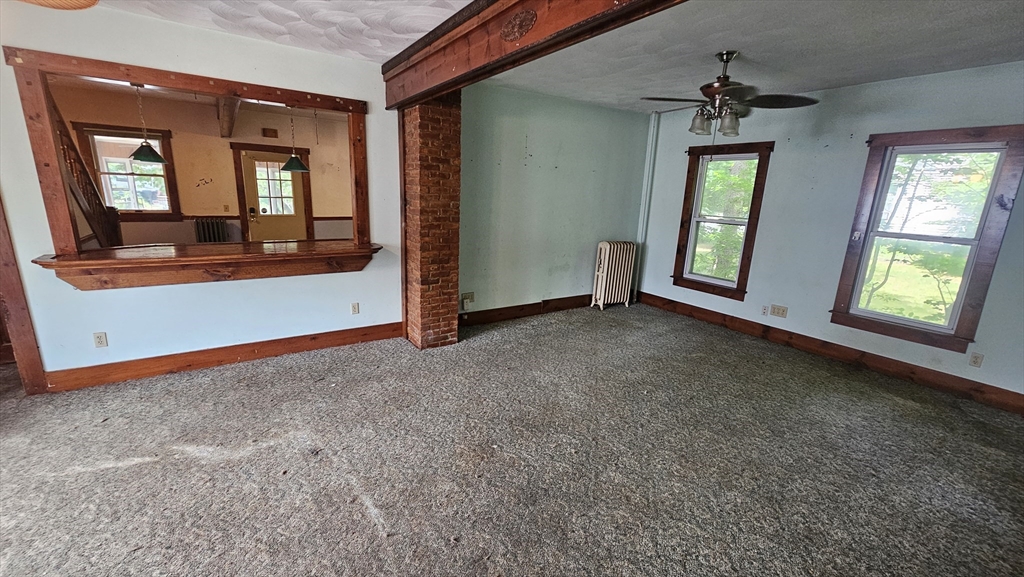 179 Oak Street Springfield, MA 01151 - Photo 9 of 28 an empty room with windows and closet