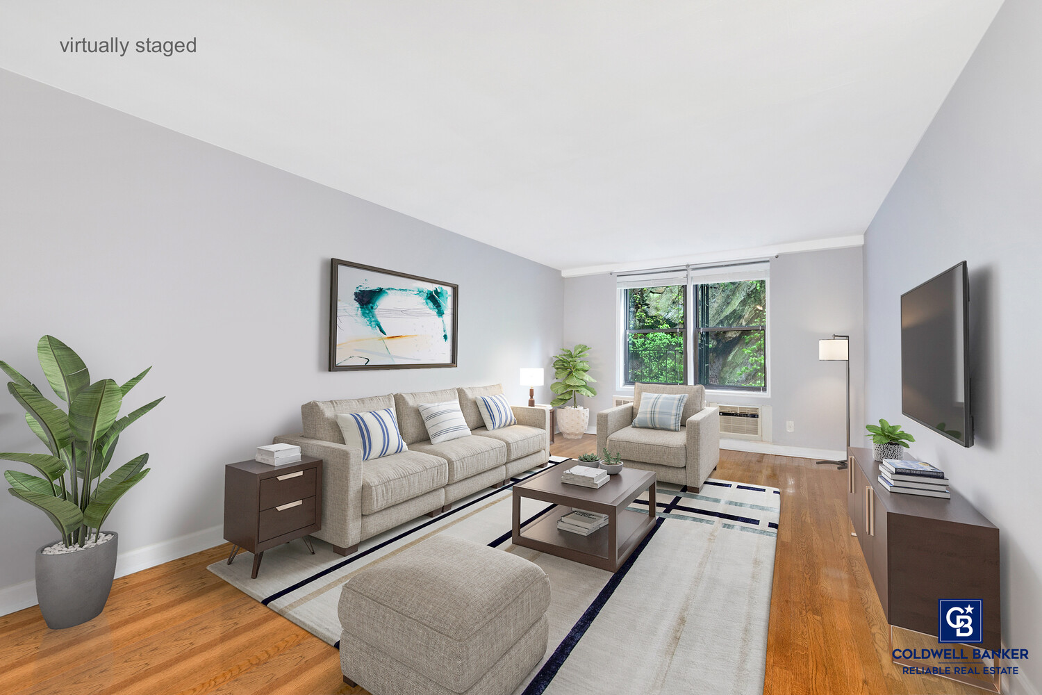 5235 Post Road, Unit 2C Bronx, NY 10471 - Photo 1 of 10 a living room with furniture potted plant and a flat screen tv