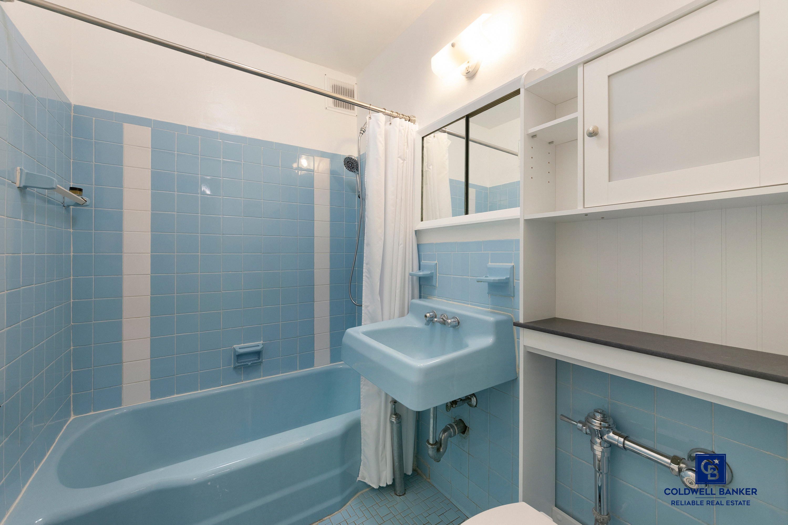 5235 Post Road, Unit 2C Bronx, NY 10471 - Photo 7 of 10 a bathroom with a sink mirror toilet and bathtub