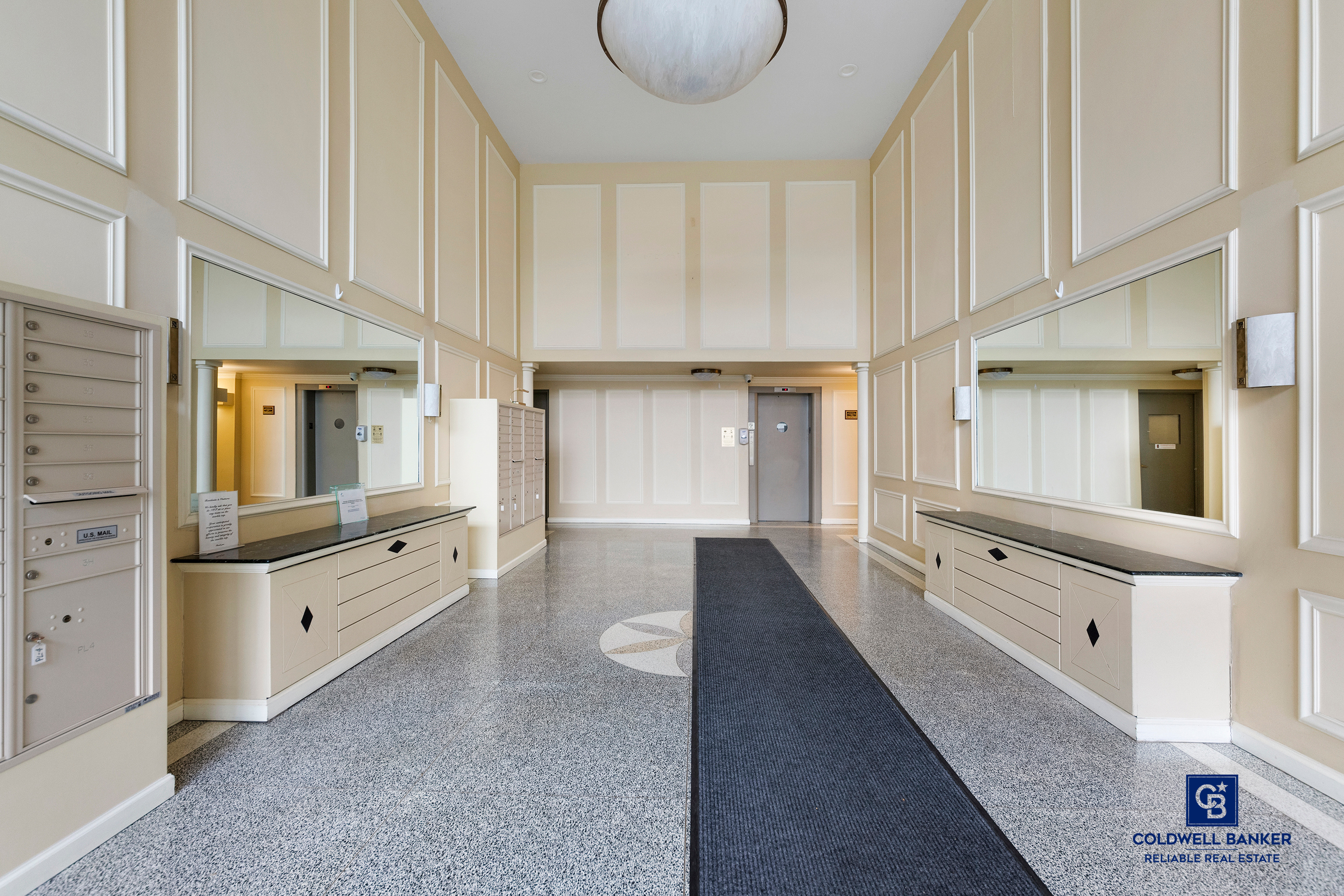 5235 Post Road, Unit 2C Bronx, NY 10471 - Photo 8 of 10 wooden floor with white cabinets and window