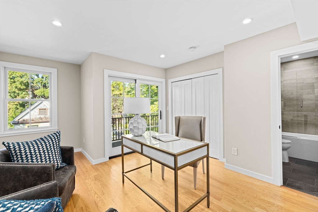 56-58 Perry Street, Unit 4 Brookline, MA 02446 - Photo 13 of 17 a living room with furniture and a window