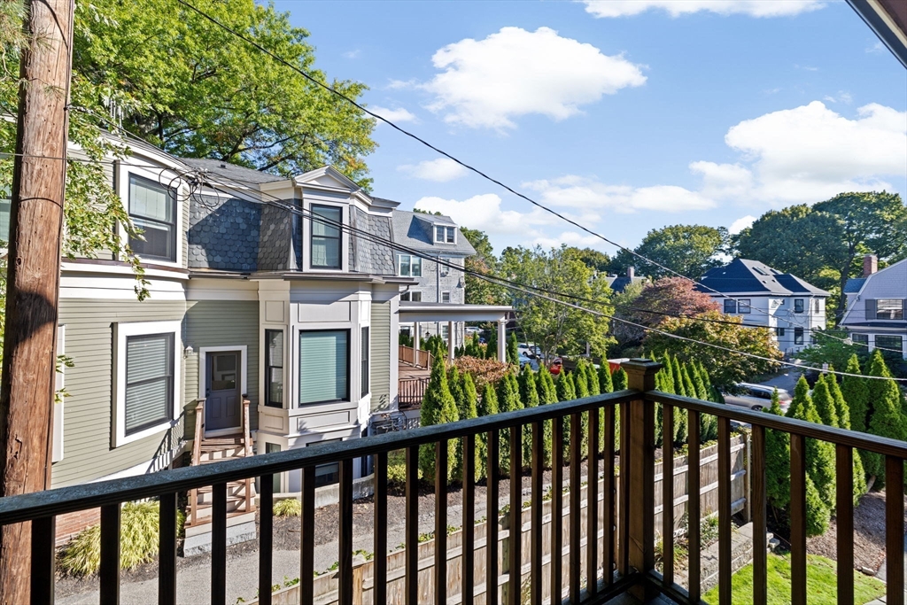 56-58 Perry Street, Unit 4 Brookline, MA 02446 - Photo 15 of 17 a view of a brick house with a large windows