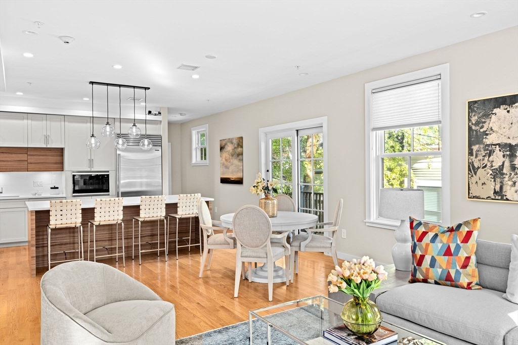56-58 Perry Street, Unit 4 Brookline, MA 02446 - Photo 4 of 17 a living room with furniture kitchen view and a large window