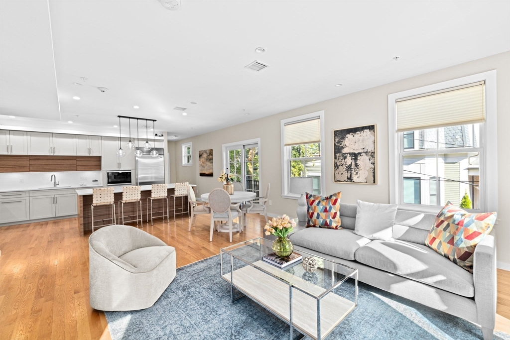 56-58 Perry Street, Unit 4 Brookline, MA 02446 - Photo 5 of 17 a living room with furniture and a large window