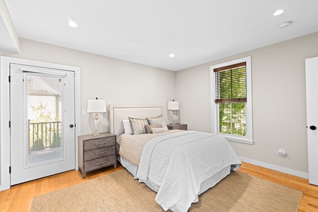 56-58 Perry Street, Unit 4 Brookline, MA 02446 - Photo 8 of 17 a bedroom with a bed next to a window