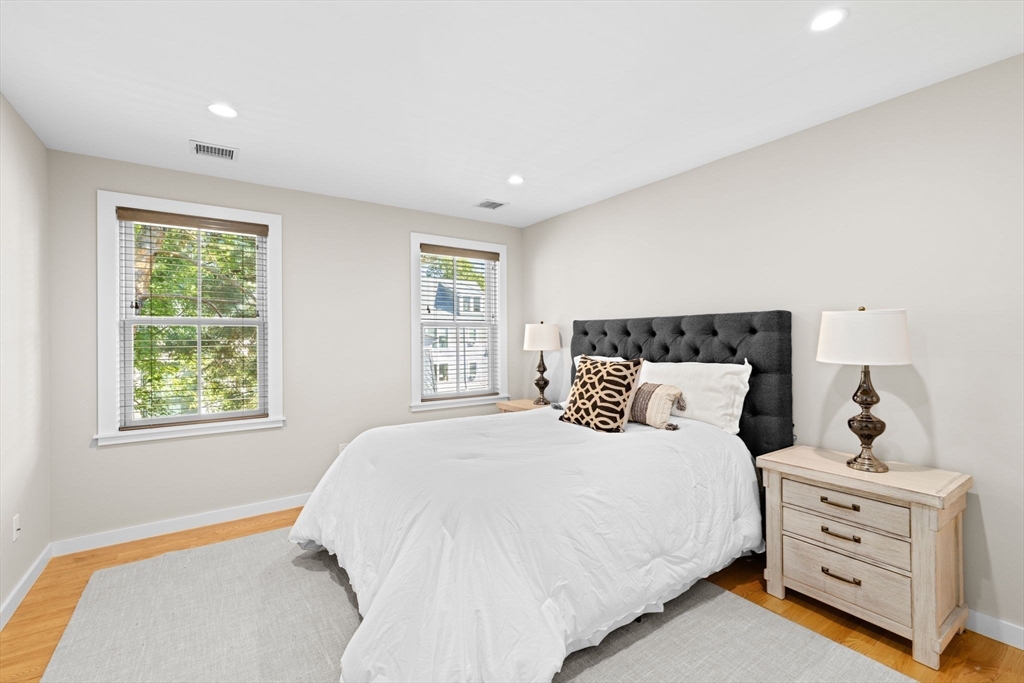 56-58 Perry Street, Unit 4 Brookline, MA 02446 - Photo 10 of 17 a bedroom with a bed and window