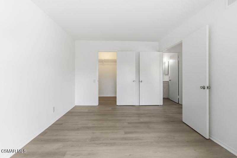 584 Rio Grande Circle Thousand Oaks, CA 91360 - Photo 12 of 19 a view of an empty room with wooden floor