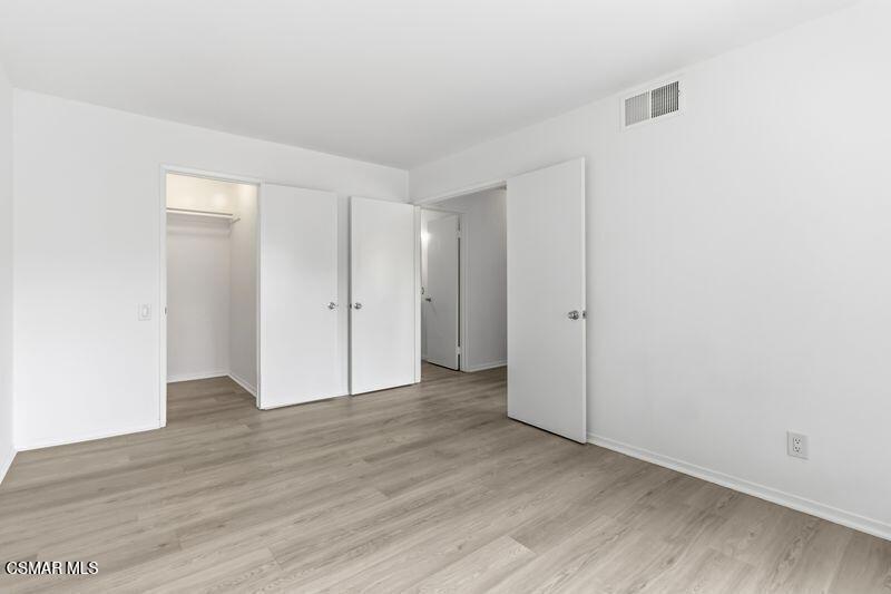 584 Rio Grande Circle Thousand Oaks, CA 91360 - Photo 13 of 19 an empty room with wooden floor & closet area