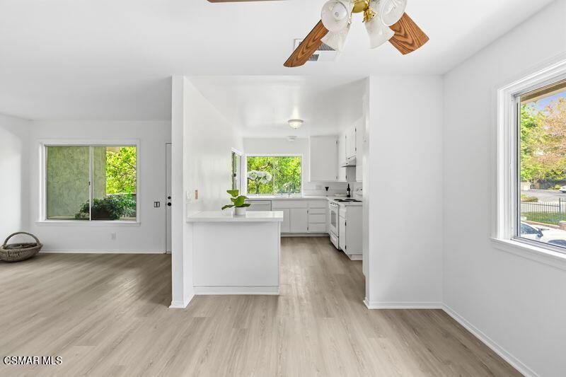 584 Rio Grande Circle Thousand Oaks, CA 91360 - Photo 7 of 19 a view of an empty room with a window and wooden floor