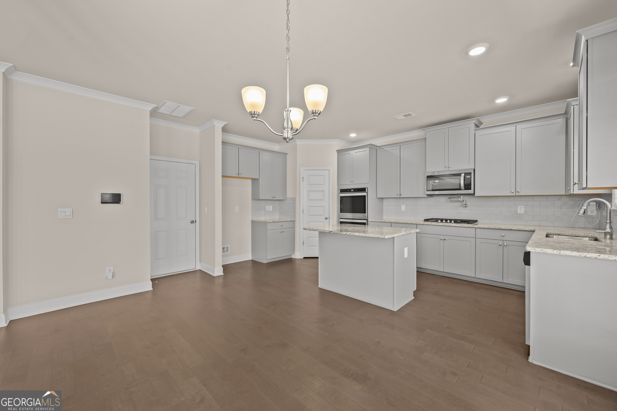 324 Conley Avenue Hampton, GA 30228 - Photo 12 of 59 a view of a kitchen with electric appliances and cabinets