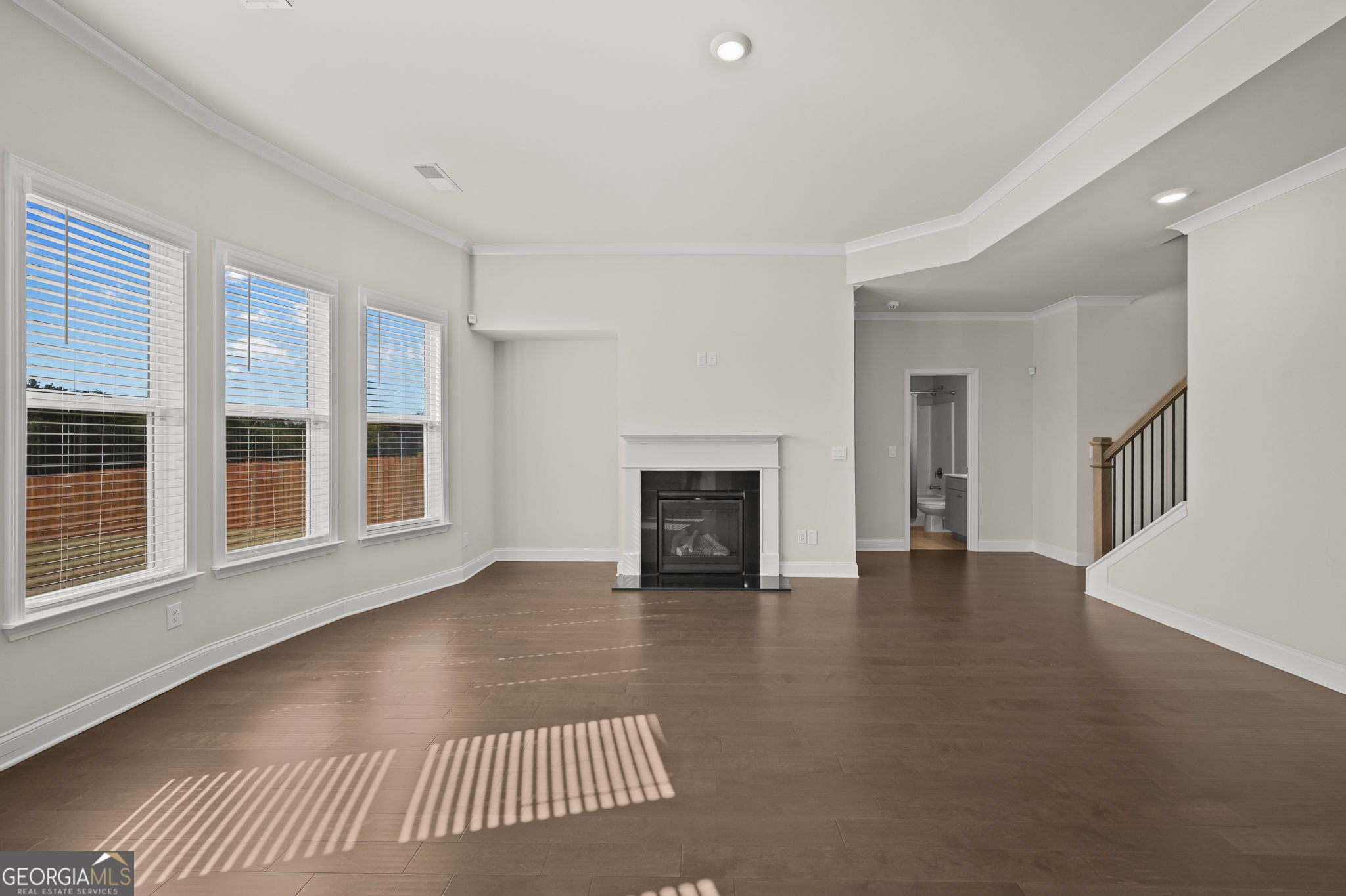324 Conley Avenue Hampton, GA 30228 - Photo 18 of 59 a view of a livingroom with wooden floor and a fireplace