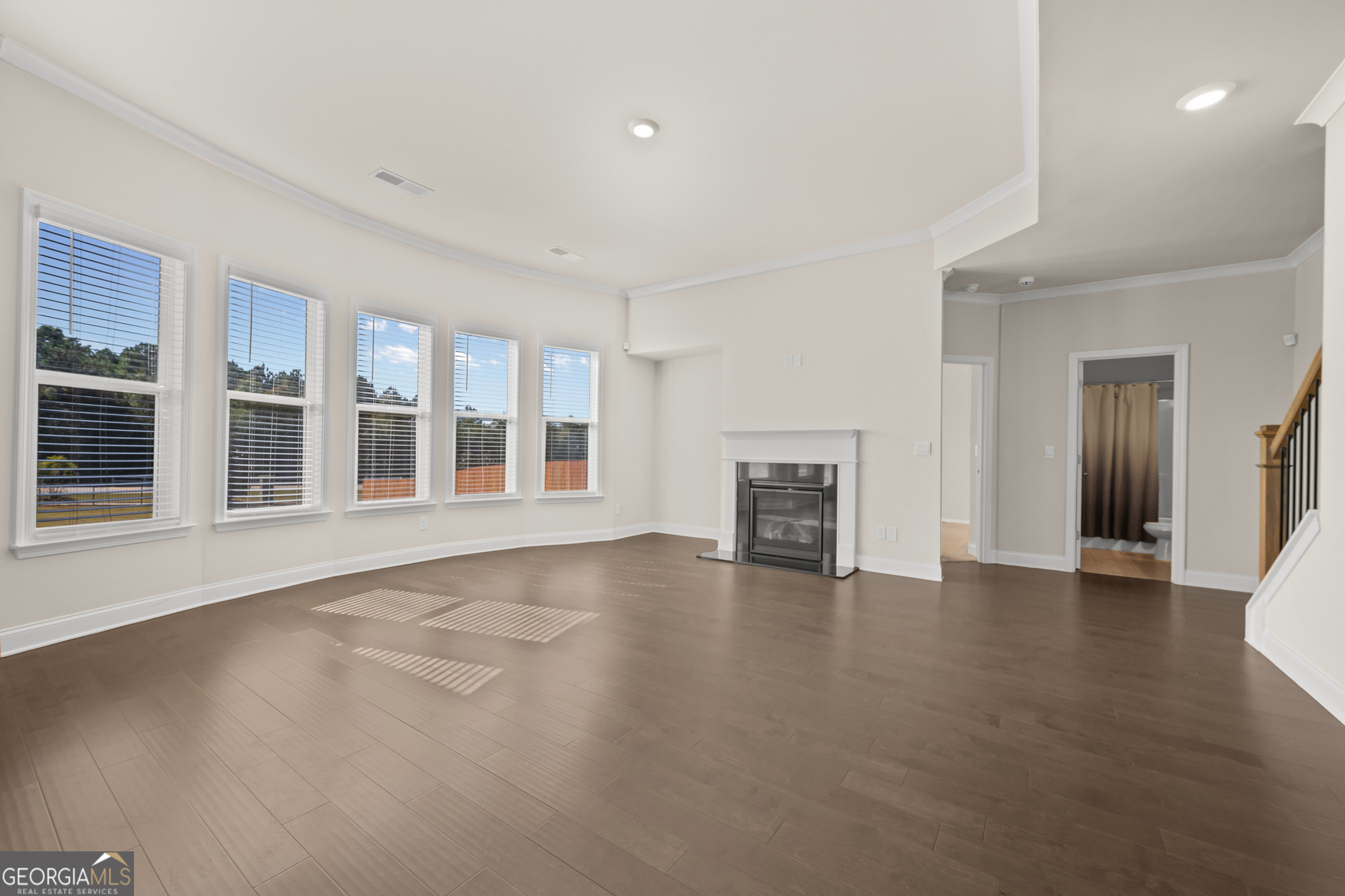 324 Conley Avenue Hampton, GA 30228 - Photo 20 of 59 a view of an empty room with wooden floor and a window