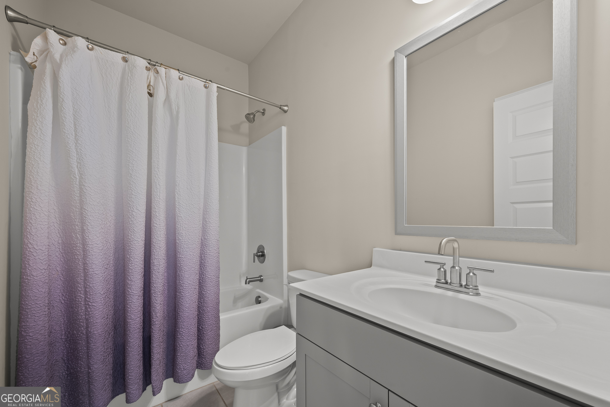 324 Conley Avenue Hampton, GA 30228 - Photo 22 of 59 a bathroom with a granite countertop sink toilet and a mirror