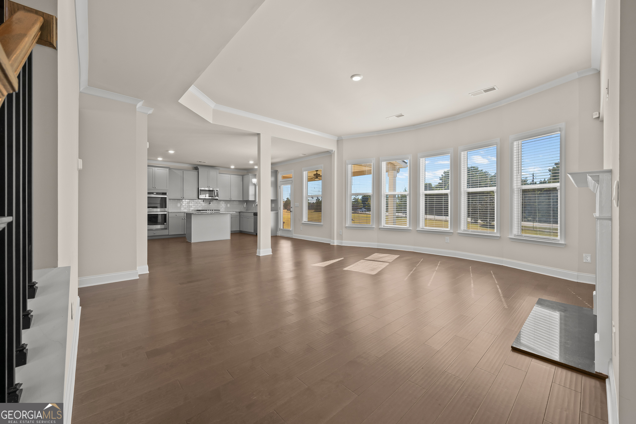 324 Conley Avenue Hampton, GA 30228 - Photo 23 of 59 a view of an empty room with wooden floor and a window