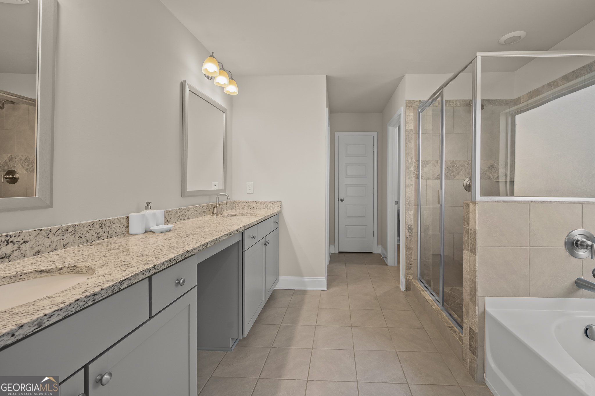 324 Conley Avenue Hampton, GA 30228 - Photo 33 of 59 a bathroom with a granite countertop sink a toilet a mirror and shower