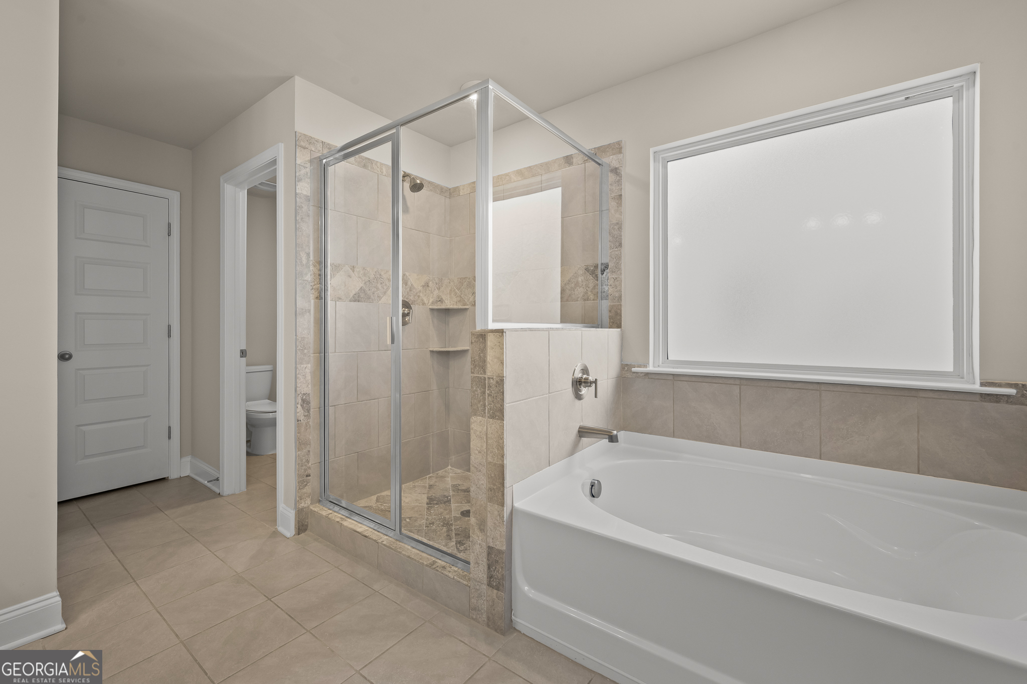 324 Conley Avenue Hampton, GA 30228 - Photo 34 of 59 a bathroom with a bathtub and a shower