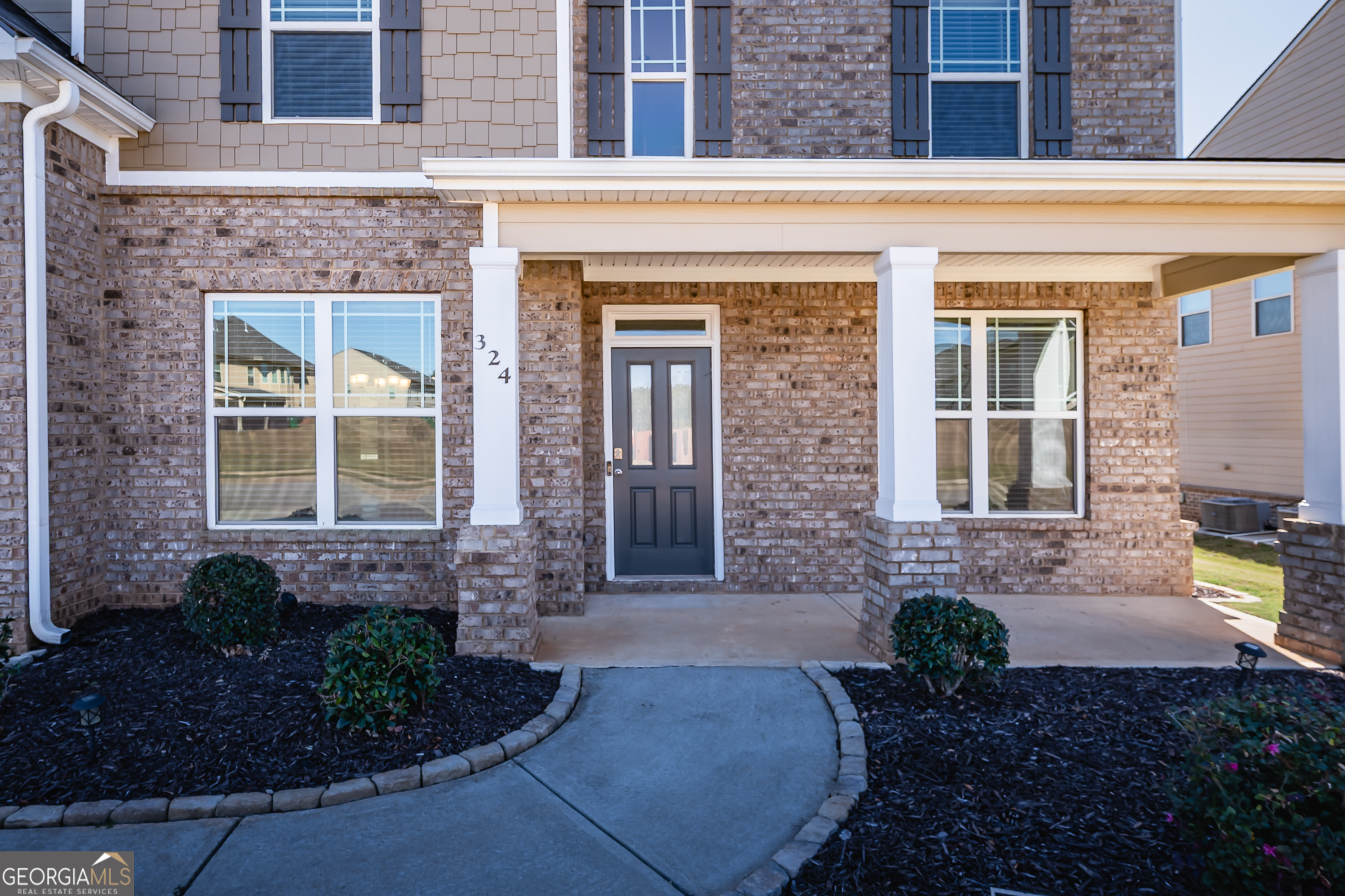 324 Conley Avenue Hampton, GA 30228 - Photo 4 of 59 a front view of a house