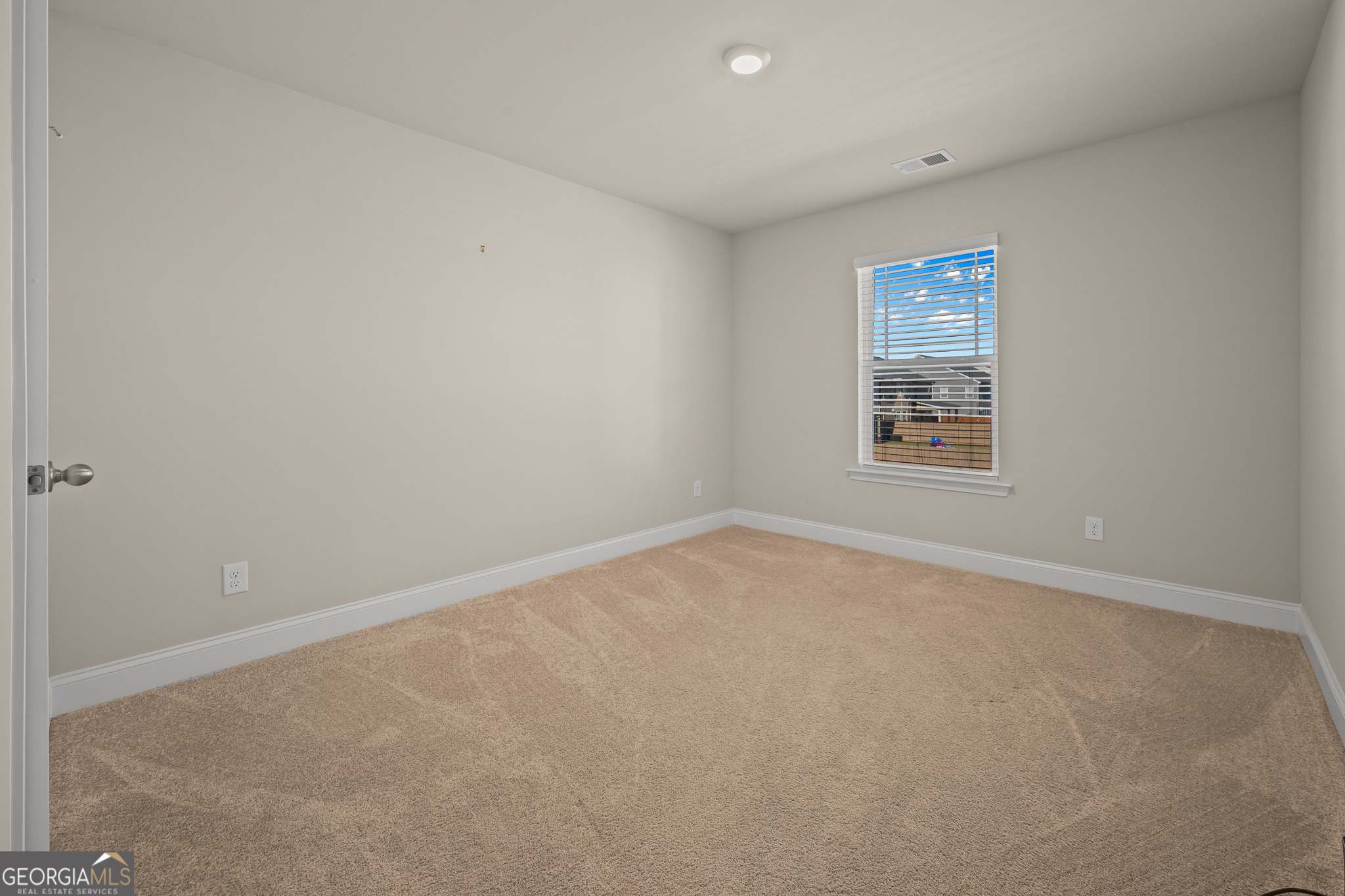 324 Conley Avenue Hampton, GA 30228 - Photo 41 of 59 an empty room with a window