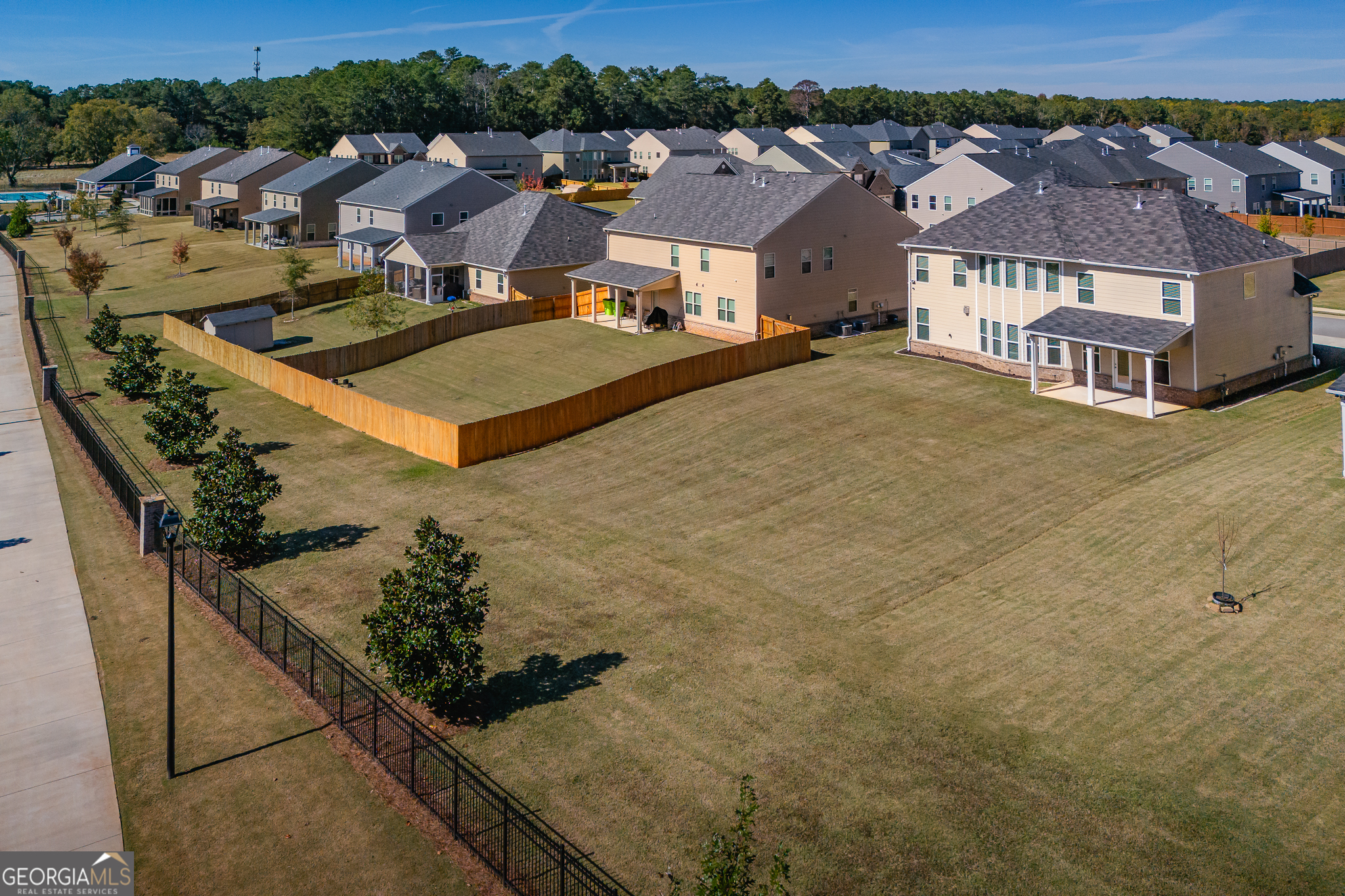 324 Conley Avenue Hampton, GA 30228 - Photo 54 of 59 an aerial view of residential houses with outdoor space