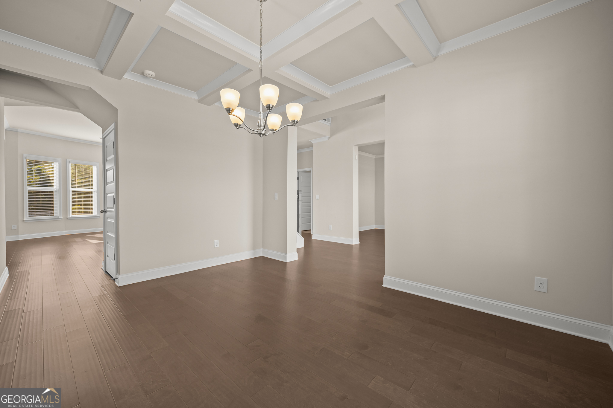 324 Conley Avenue Hampton, GA 30228 - Photo 9 of 59 an empty room with wooden floor and windows