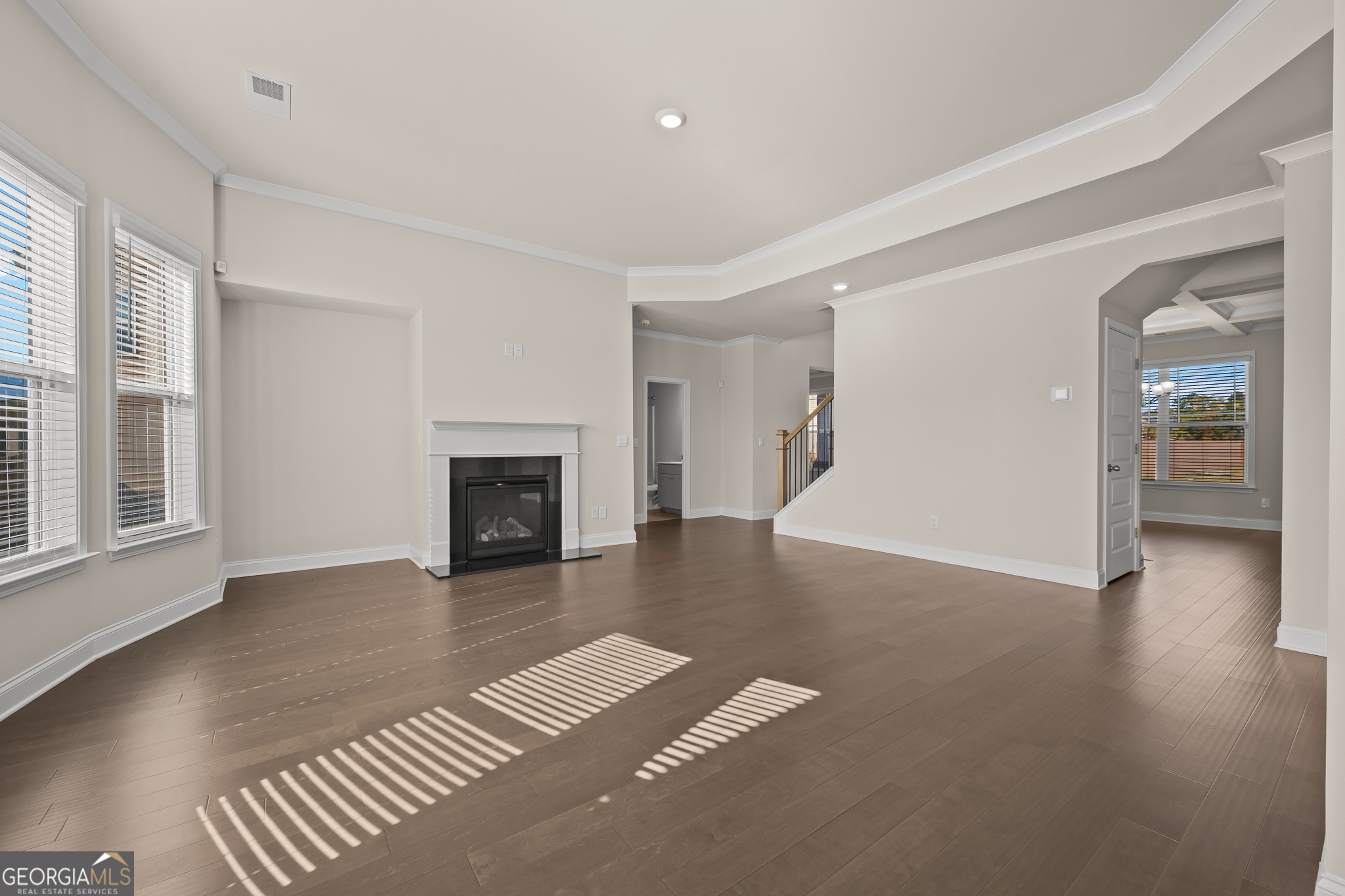 324 Conley Avenue Hampton, GA 30228 - Photo 10 of 59 an empty room with windows and a fireplace