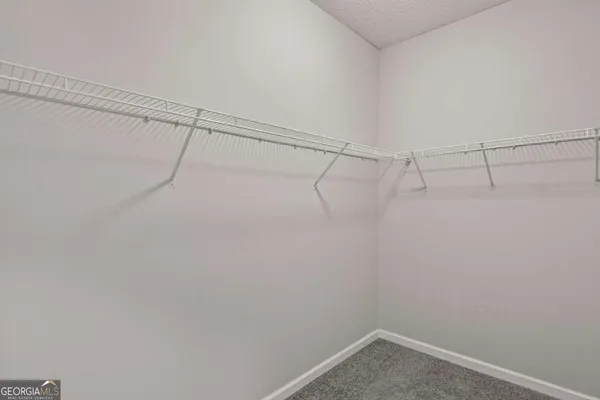 a view of a room with racks on the wall