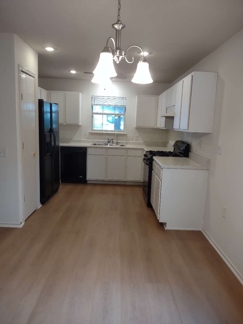 11709 Briarcreek Loop Manor, TX 78653 - Photo 5 of 19 Functional kitchen with ample cabinet space and durable flooring.