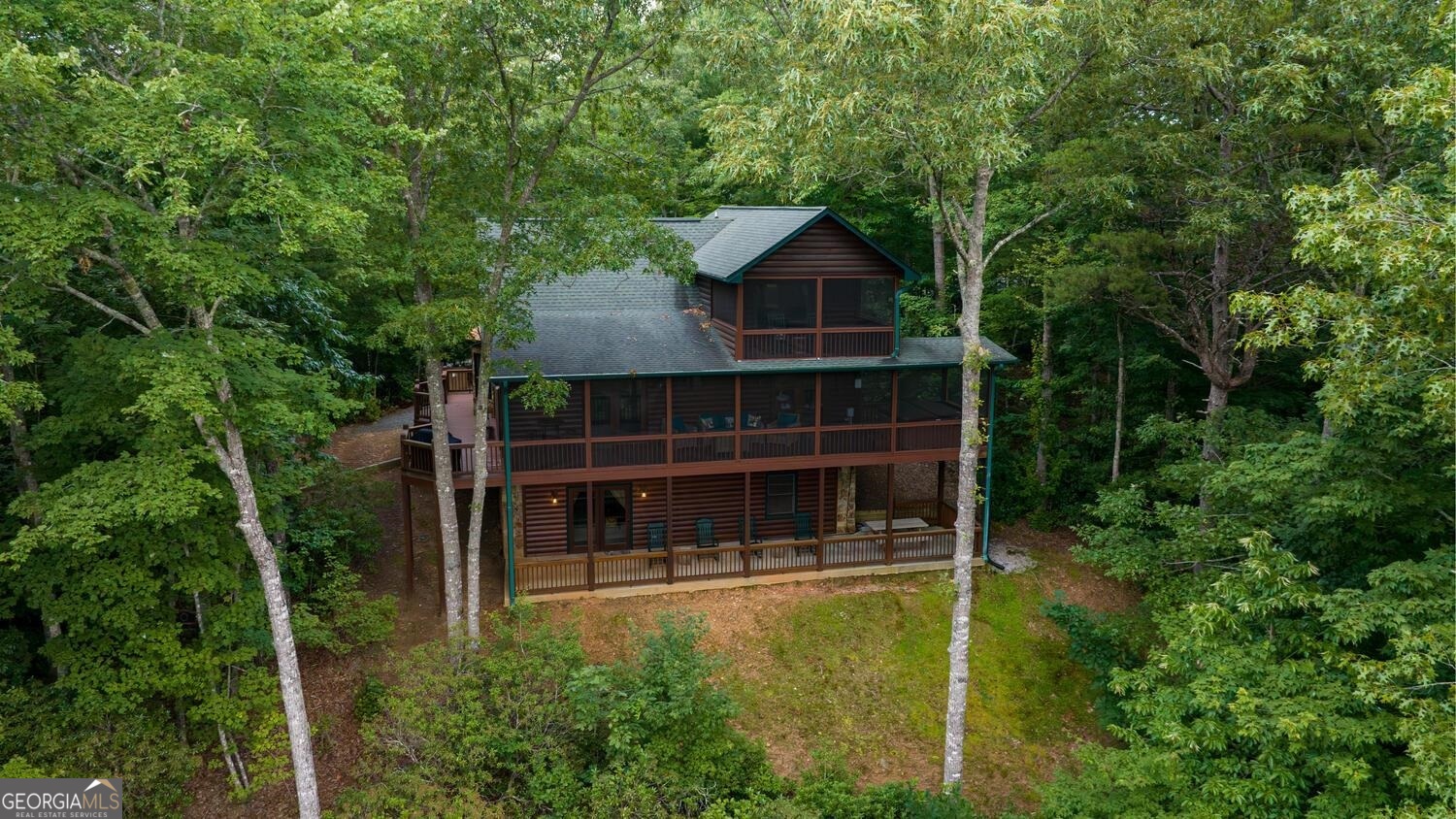 273 Hiawatha Trail, Unit 416 Blue Ridge, GA 30513 - Photo 1 of 1 a front view of a house with a yard