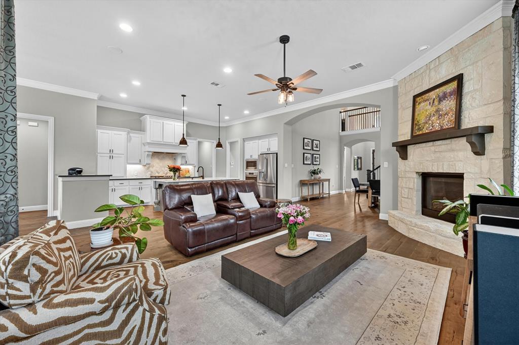 6656 Roughleaf Ridge Road Flower Mound, TX 76226 - Photo 8 of 40 a living room with furniture and a fireplace