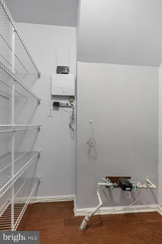 a view of storage and utility room with empty racks