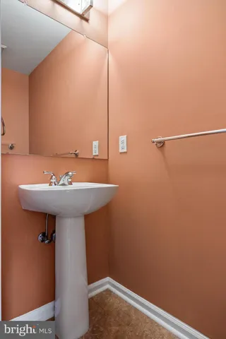 a bathroom with a sink and mirror