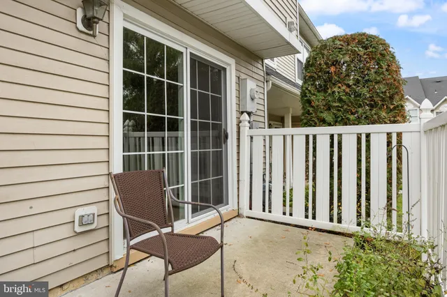 a view of a chair and table in the porch