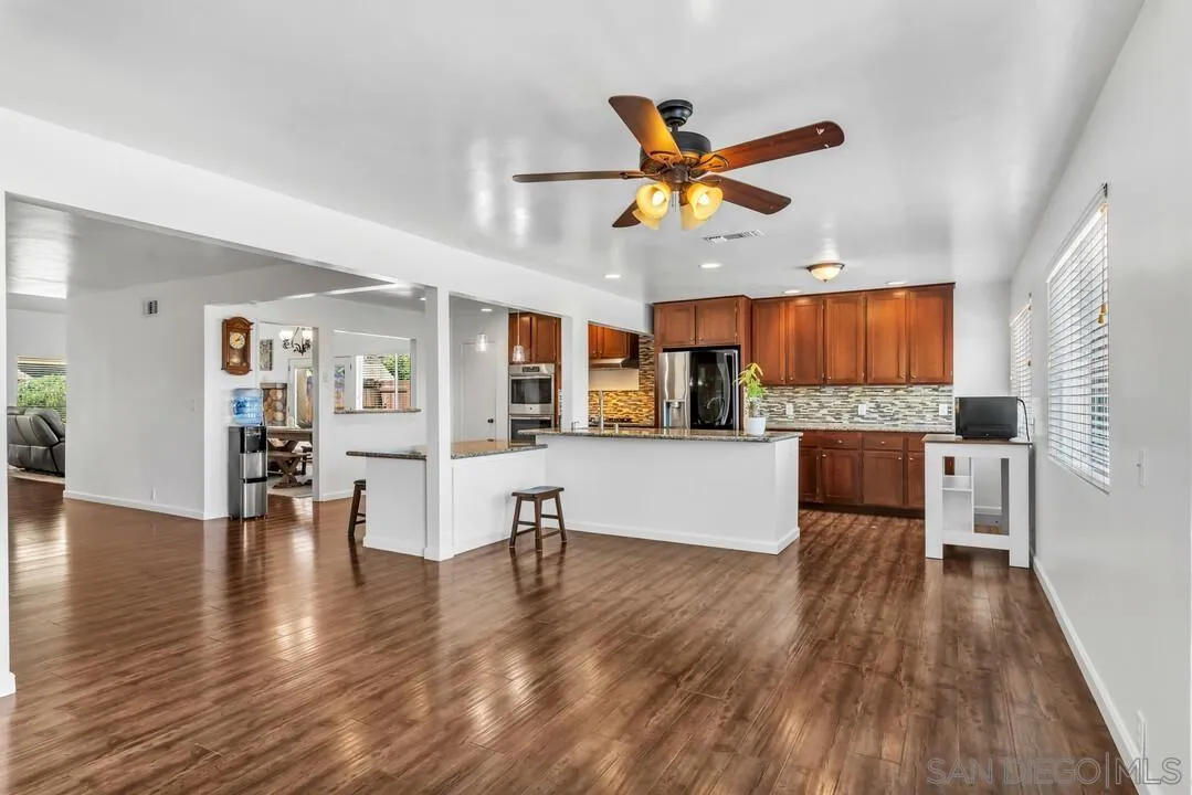 1509 Honey Hill Road El Cajon, CA 92020 - Photo 18 of 49 a living room with stainless steel appliances furniture and a wooden floor