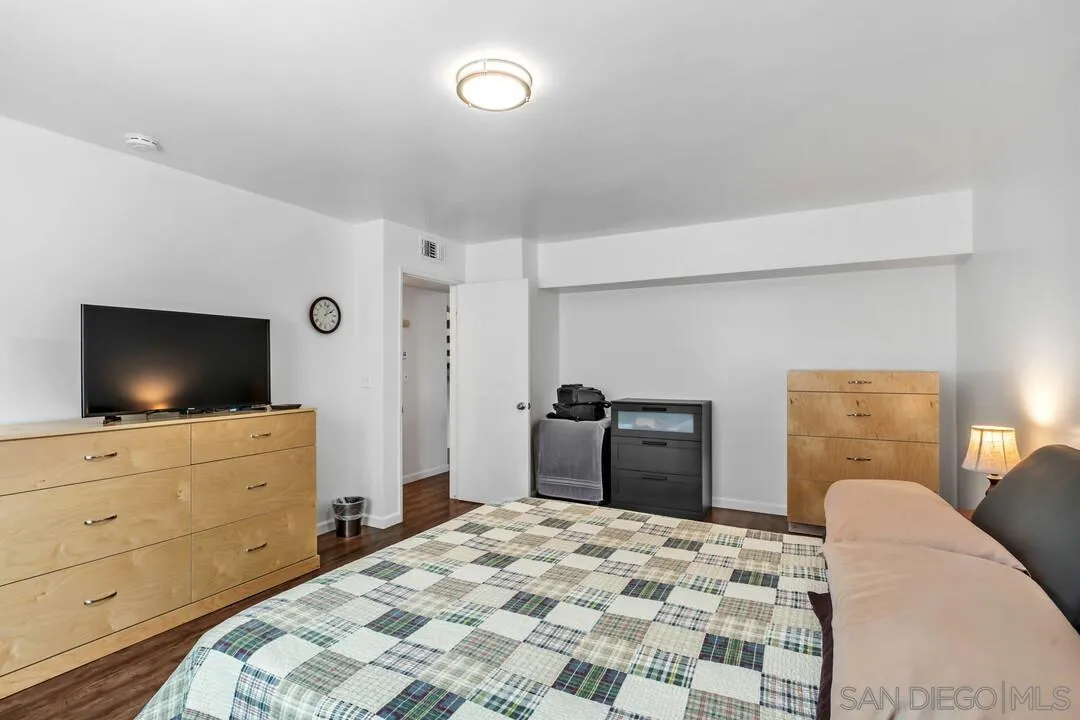1509 Honey Hill Road El Cajon, CA 92020 - Photo 23 of 49 a bedroom with a bed and a flat screen tv in it