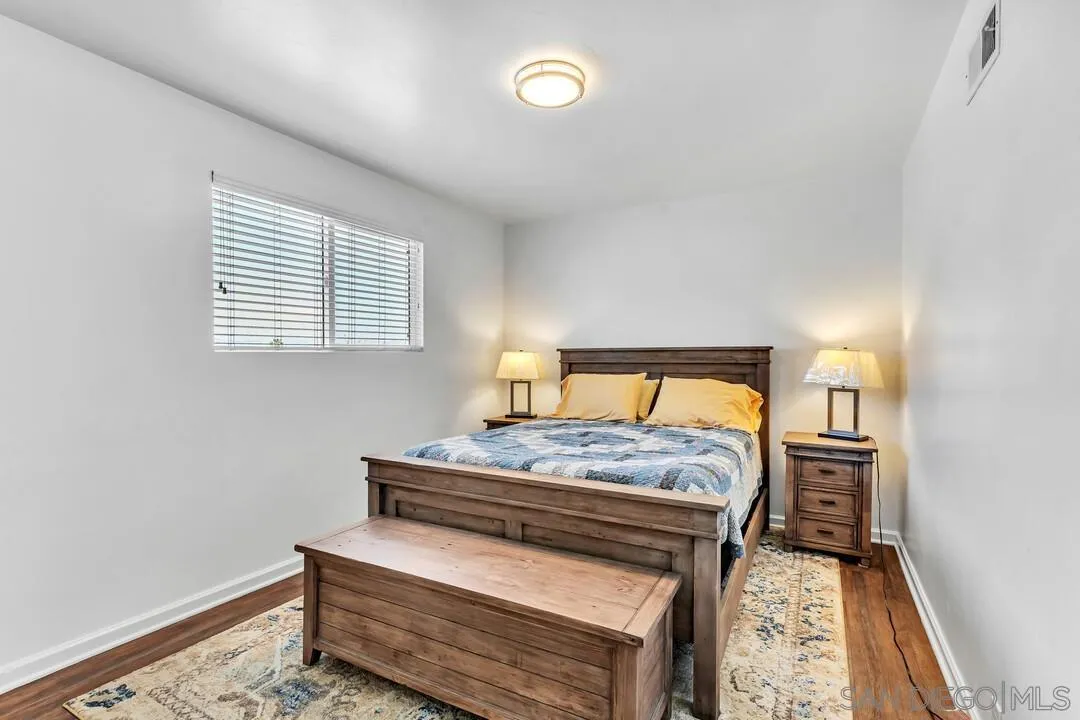 1509 Honey Hill Road El Cajon, CA 92020 - Photo 25 of 49 a bedroom with a bed and window