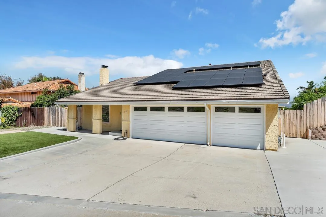 1509 Honey Hill Road El Cajon, CA 92020 - Photo 3 of 49 a front view of a house with a yard and garage