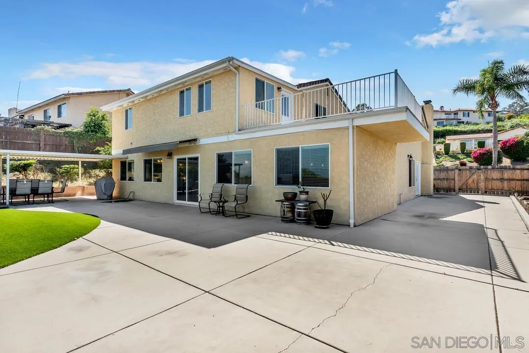 1509 Honey Hill Road El Cajon, CA 92020 - Photo 39 of 49 a view of a white house with swimming pool table and chairs