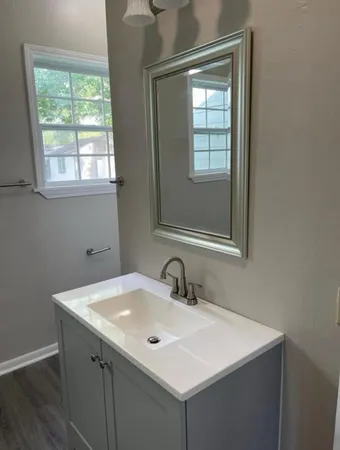 a bathroom with a sink and a mirror