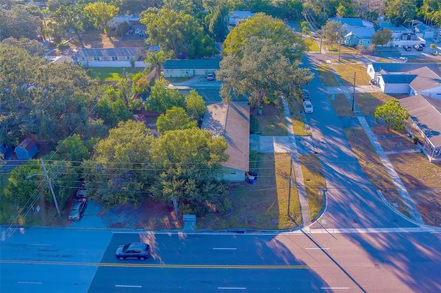 a view of a patio with table and chairs and potted plants