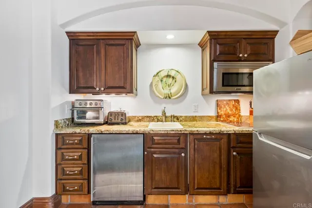 a spacious bedroom with a bed and window