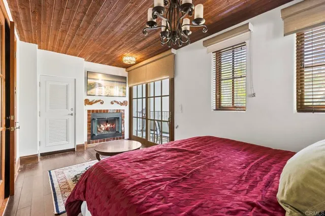 a bedroom with a bed and a fireplace