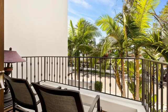 a bathroom with a granite countertop sink a mirror and a shower