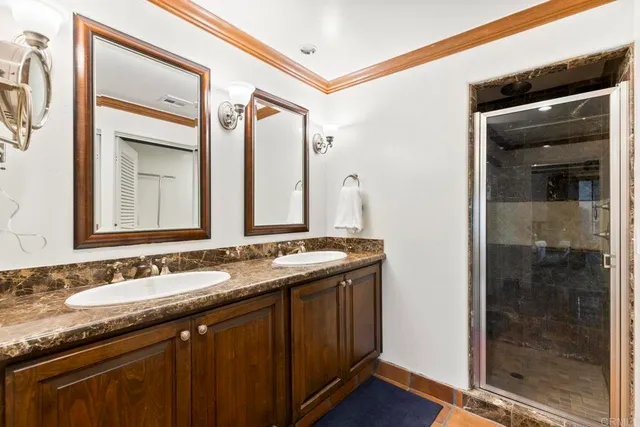 a bathroom with a tub and shower