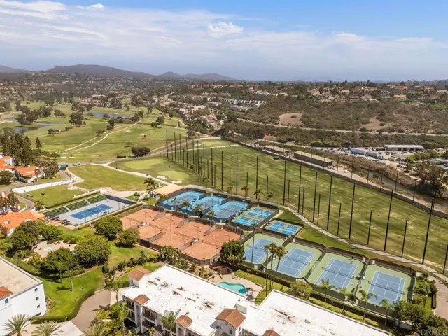 an aerial view of residential building and ocean