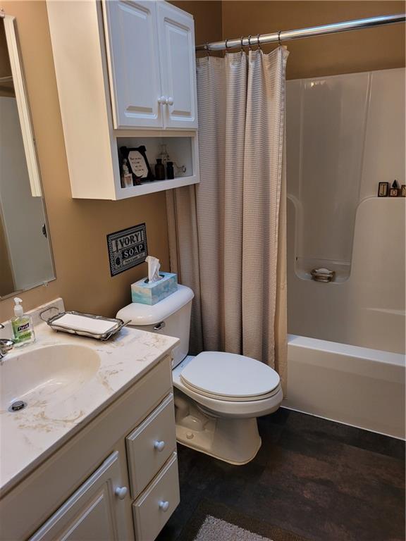 662 Great Belt Road Butler, PA 16002 - Photo 18 of 25 a bathroom with a granite countertop toilet sink and mirror