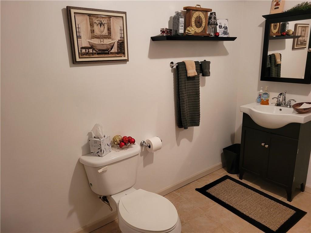 662 Great Belt Road Butler, PA 16002 - Photo 21 of 25 a bathroom with a toilet sink and mirror