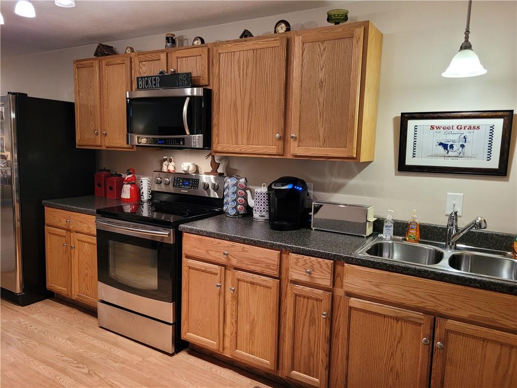 662 Great Belt Road Butler, PA 16002 - Photo 24 of 25 a kitchen with stainless steel appliances granite countertop a sink and a microwave